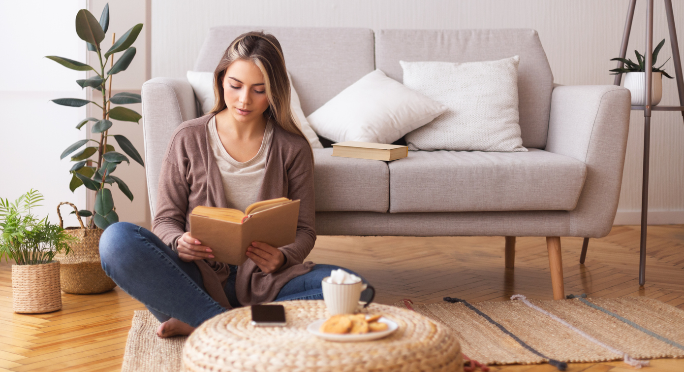 young woman having coffee at home