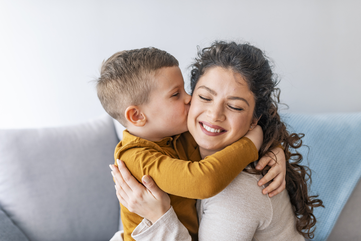 mother and son hugging