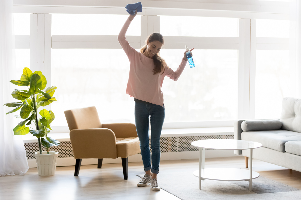 woman happy cleaning her home