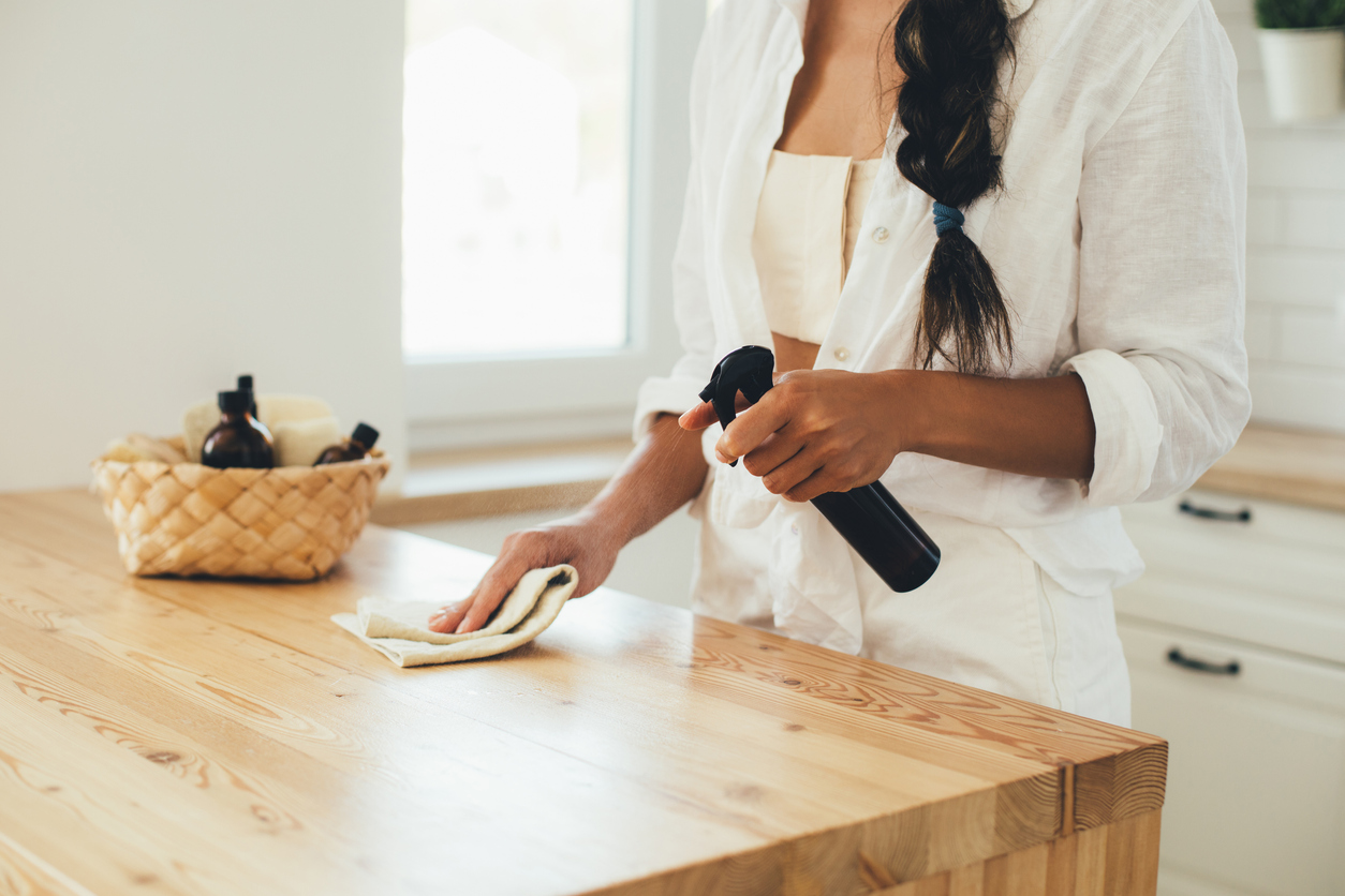 woman cleaning countertop