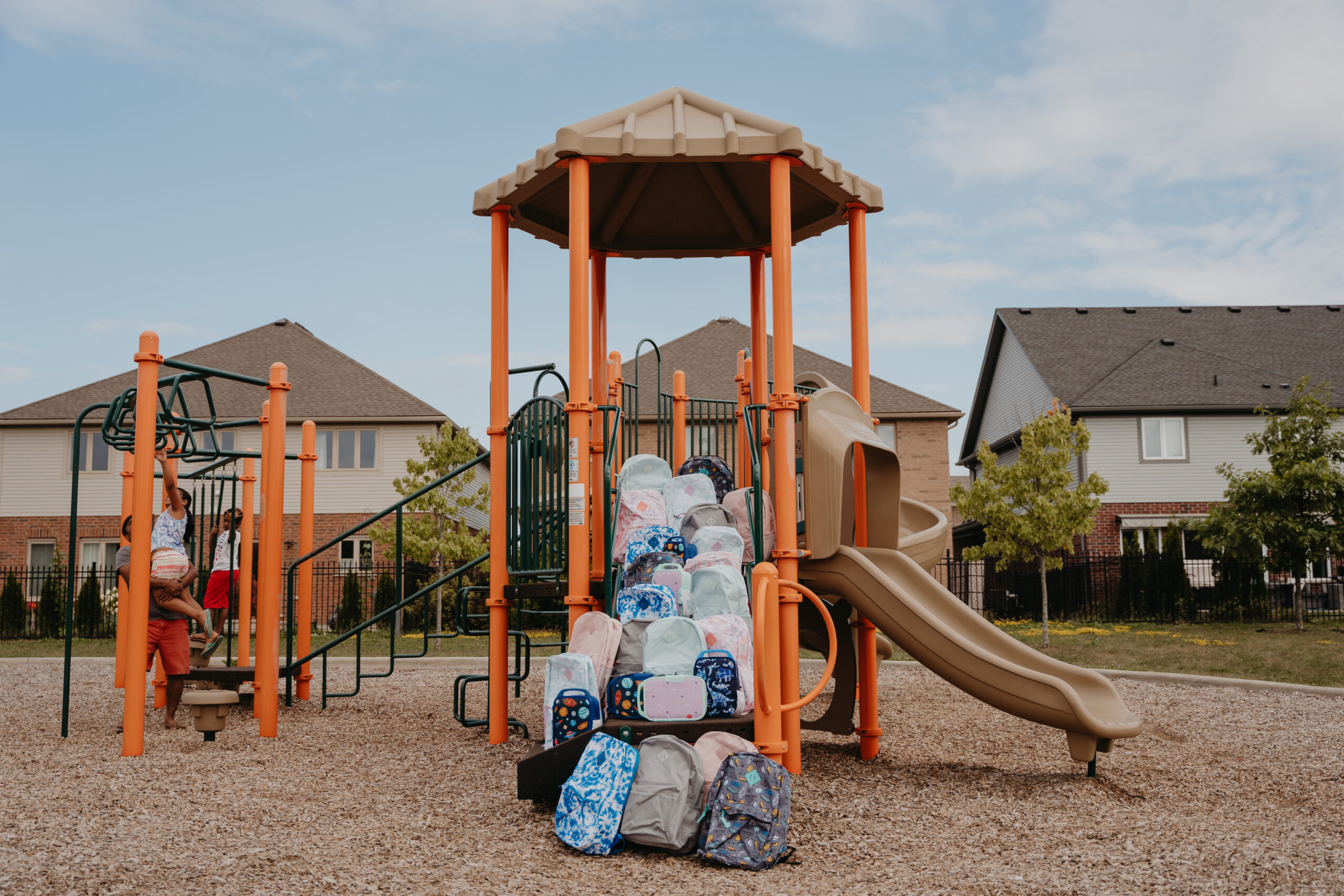 Park play structure with backpacks